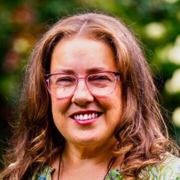 Smiling brunette woman with glasses