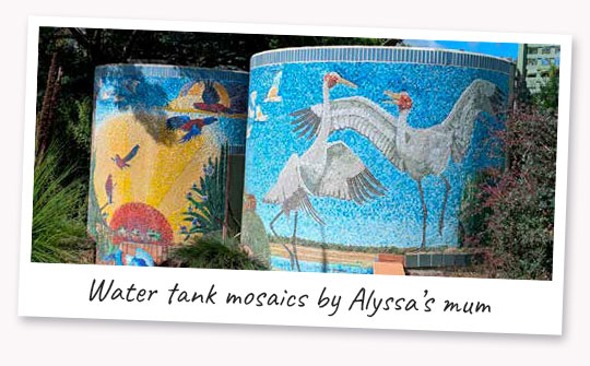 A pair of water tanks with mosaic art